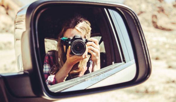 Camera in rearview mirror, illustrating ROAS for digital marketing