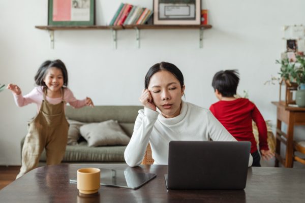 woman working from home with kids