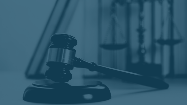 gavel and justice scales with blue overlay