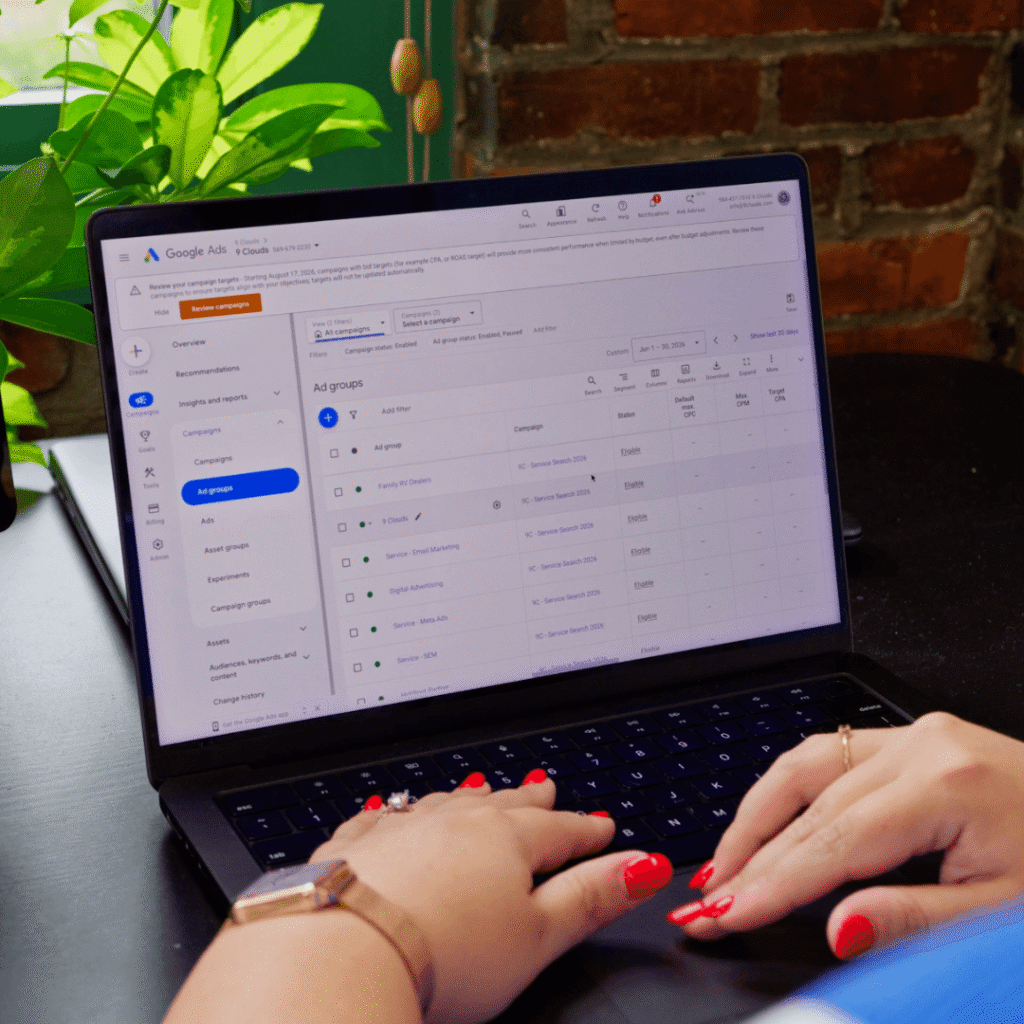 Image of 9 Clouds employee looking at google ads on a laptop